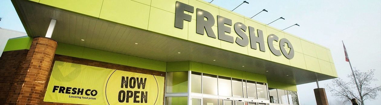 Outside of newly opened Freshco Store with now open banner