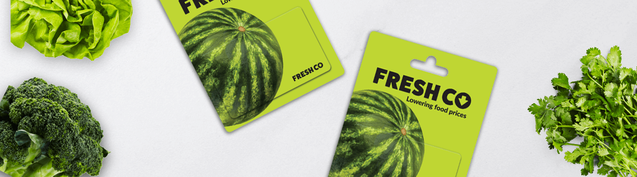 Freshco giftcards beside green vegetables
